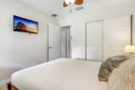 Third bedroom extends a queen-sized bed, providing ample space for two